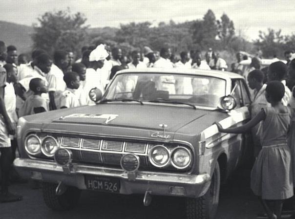 East African Safari, Kenya, Africa, 1964. Mercury Comet draws a large crowd. 